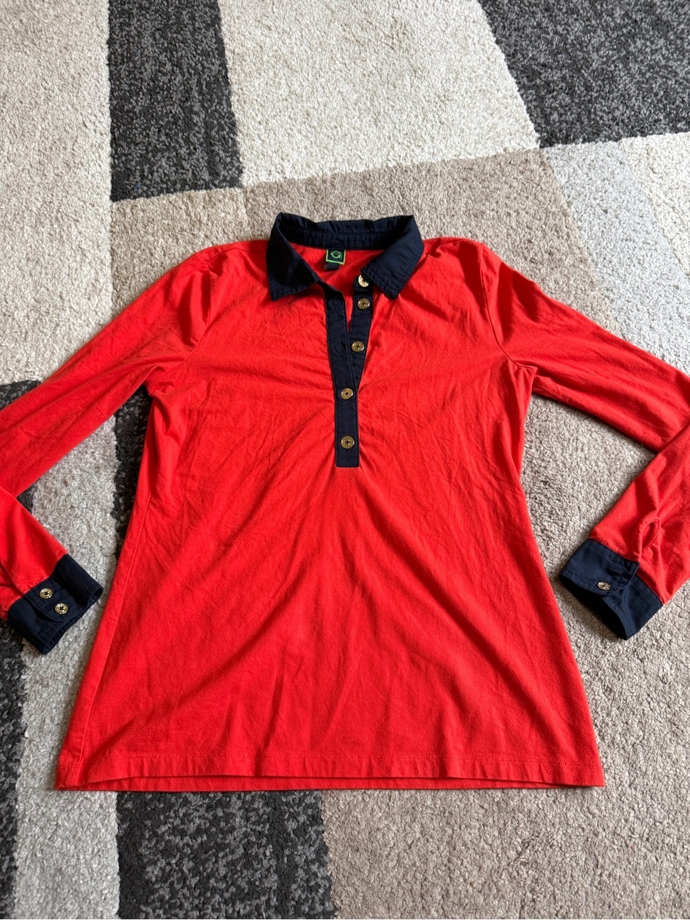 C. Wonder Women’s Red Small Long-Sleeve Polo with Navy Trim with Gold Buttons